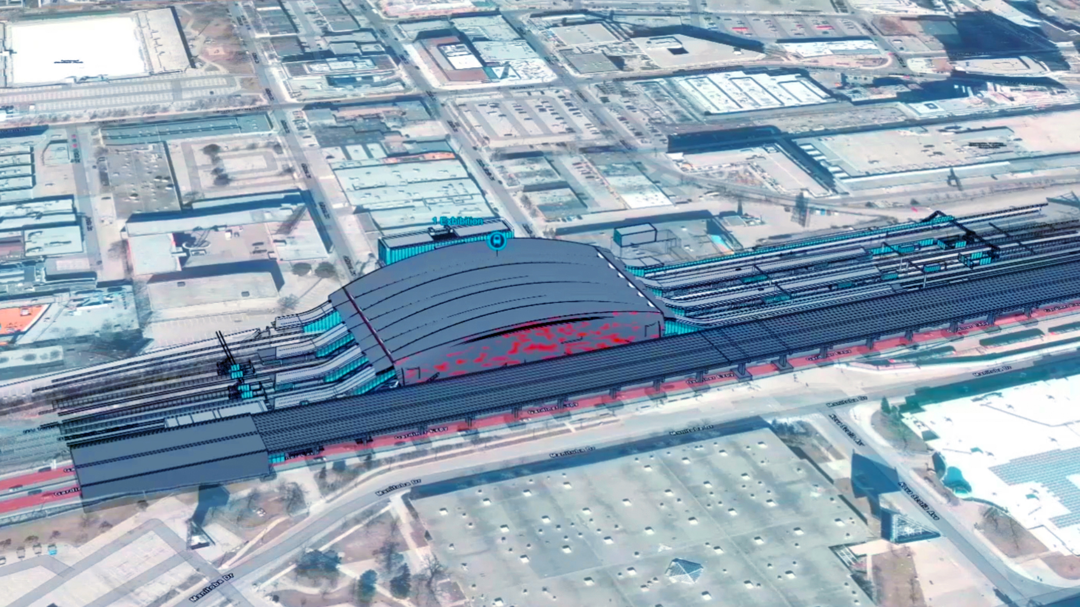 Luftansicht eines Bauplans für einen Bahnhof. Er zeigt, wie sich der Bahnhof in die städtische Umgebung einfügen würde.